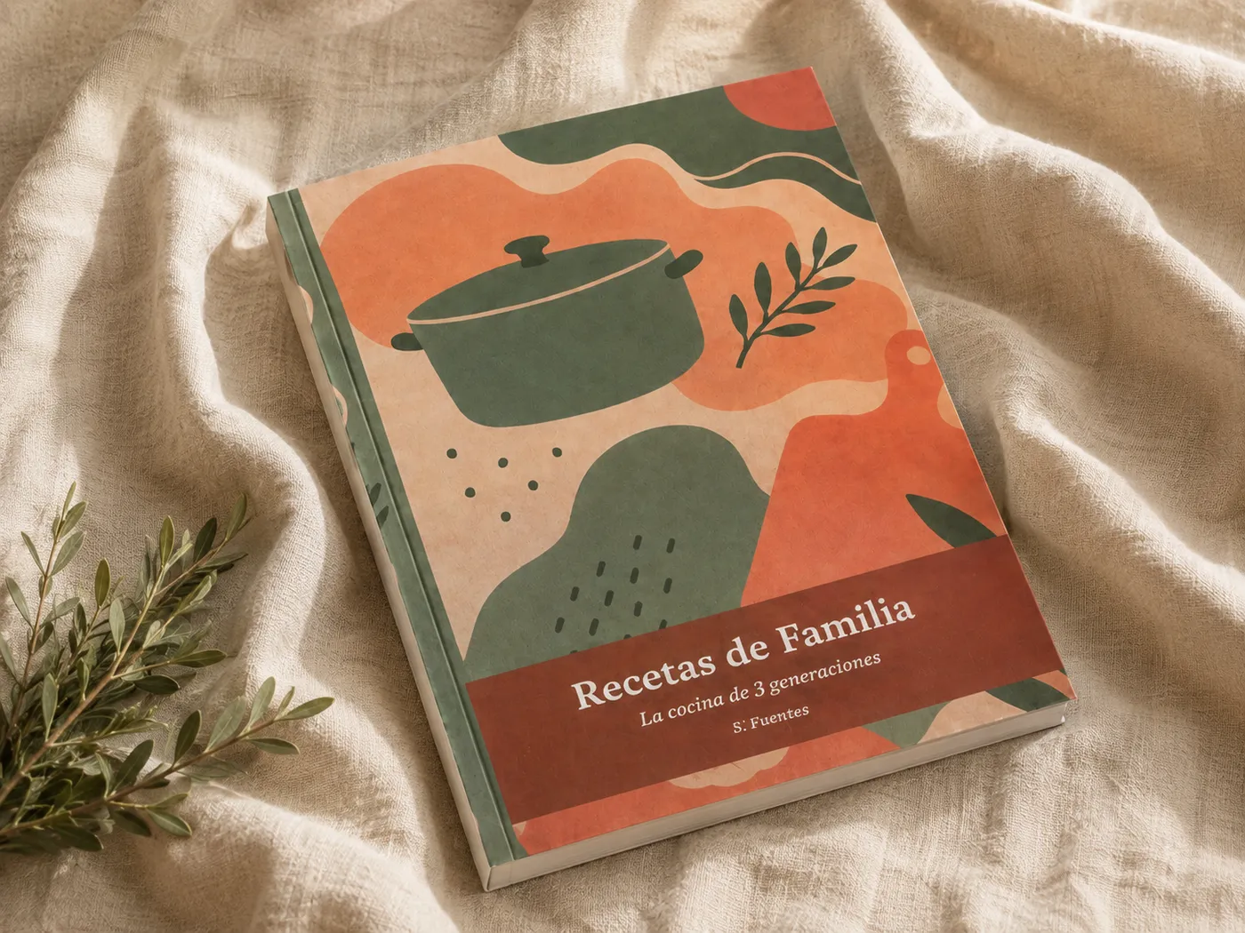 Libro de recetas de familia en tapa dura sobre una tela de lino